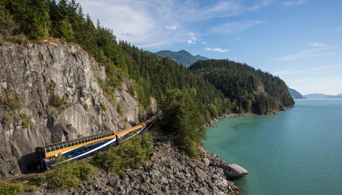 Rocky Mountaineer travelling beside Howe Sound