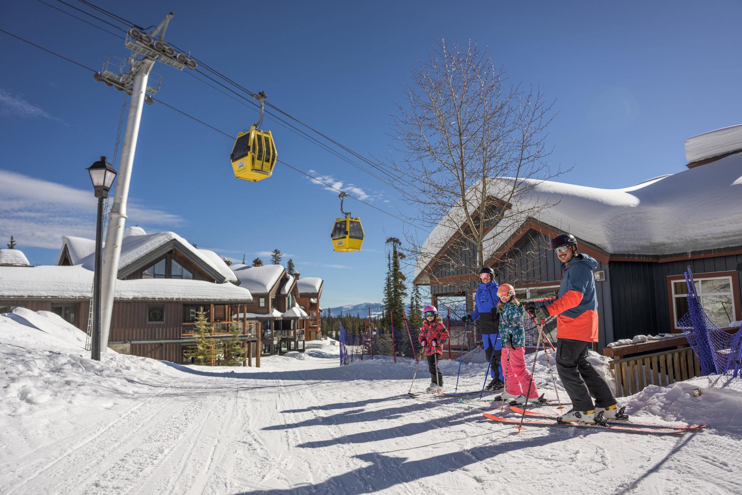 Big White gondolas above the snow-covered village